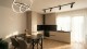 Bucătărie complet utilată, integrată în zona de living